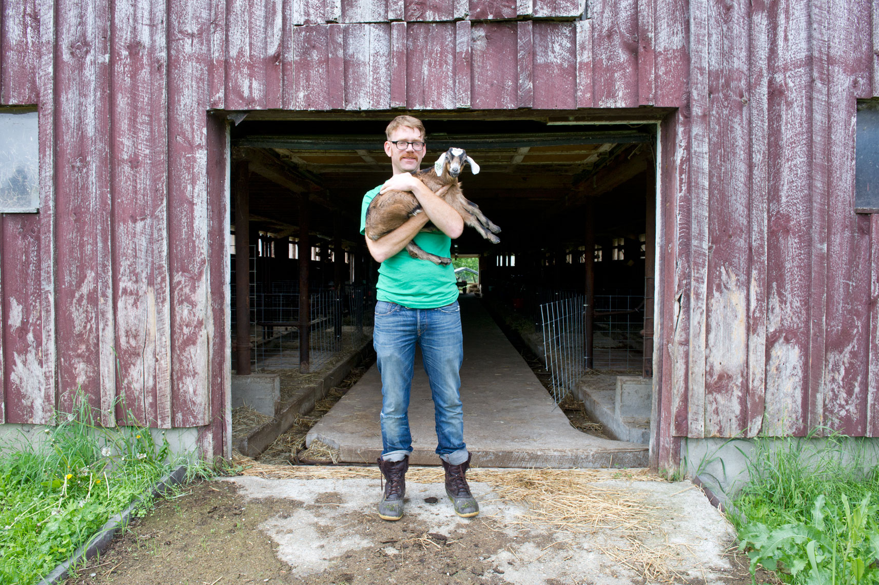 NYC + Chicago Agriculture Photographer - Man holding baby goat Consider Bardwell
